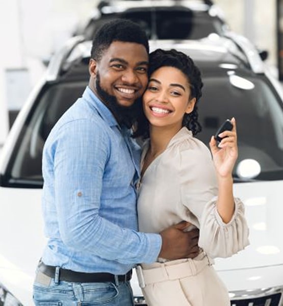 Happy Concorde Auto Acceptance customers with the keys to their financed vehicle